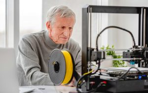 Man with 3D printer